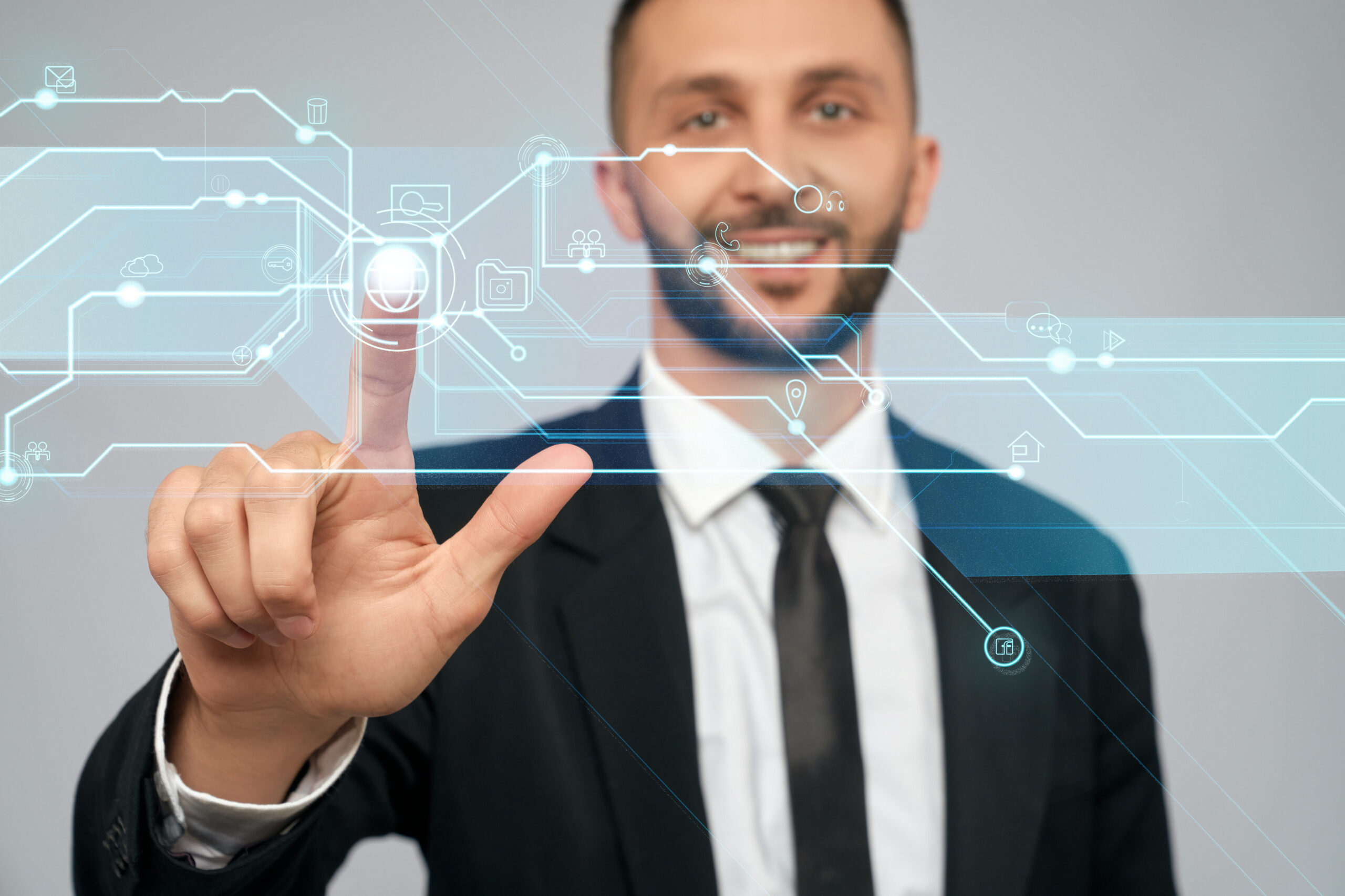 Young businessman clicking virtual button.